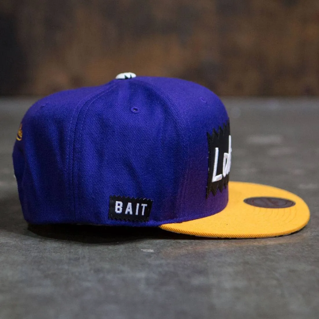 BAIT x NBA x Mitchell And Ness Los Angeles Lakers STA3 Wool Snapback Cap (purple / gold)